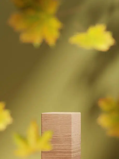 Photo of 3D background, wood podium display . Natural dry autumn leaf falling. Green backdrop with leaves shadow. Fall product promotion Beauty cosmetic, yellow wooden stand. Studio Minimal 3D render