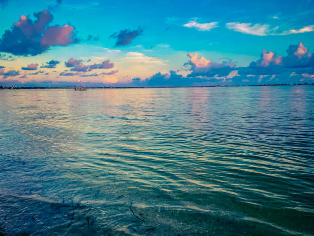colorful water reflecting the sunrise at dawn in Sanibel