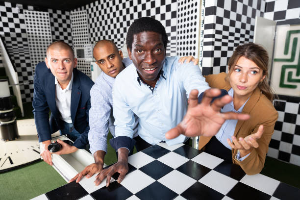 istock Four friends solving puzzles in quest room 1334887870