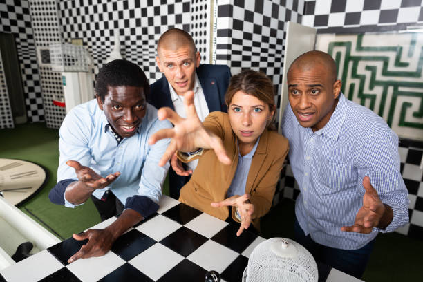 istock Four friends solving puzzles in quest room 1334887879