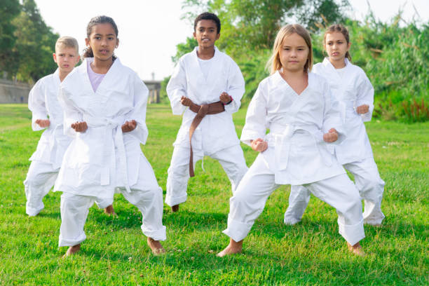 istock Kids in kimono doing kata moves 1334889067