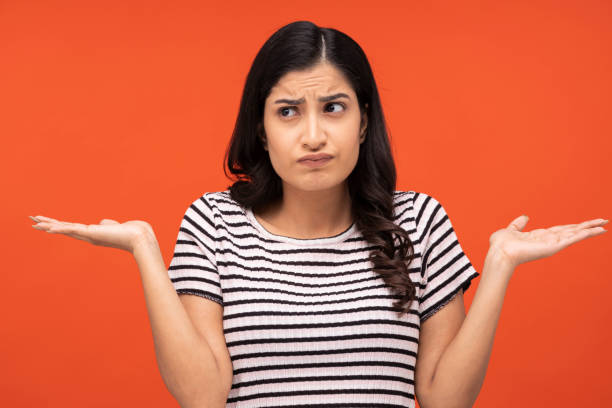 istock young woman on orange background, 1334890482