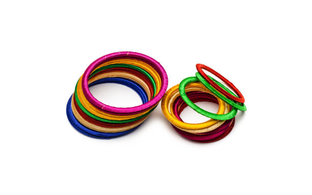 istock Two piles of colorful bobbin bangles on isolated white background 1334891571