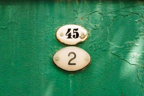 istock Number forty five and two attached to an old rusty green gate 1334892522