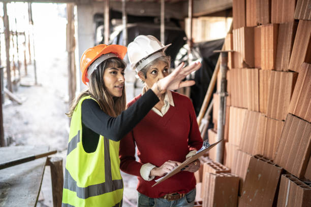 istock Engineer and contractor doing an informal meeting on construction site 1334897705