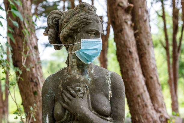 istock Statue Of Woman With Mask On 1334900933