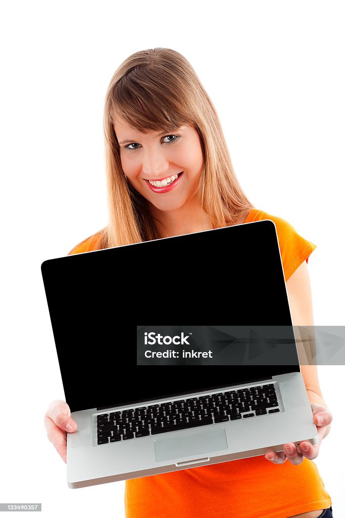 Girl with laptop Portrait of girl working on a laptop, isolated on white background. Adult Stock Photo