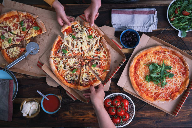 istock Eating Pizza at Home Out of Pizza Box 1334903820
