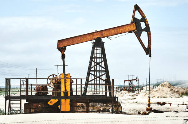 istock Old oil pump at blue cloudy sky 1334906391