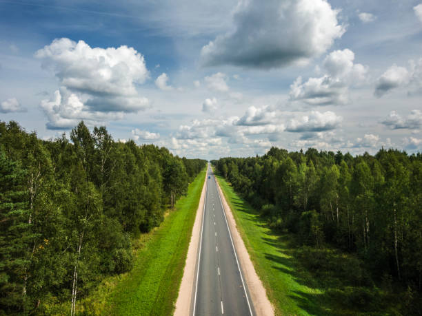 Aerial view of a highway through the forest