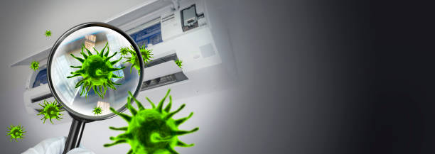 istock 3D rendering of viruses inside the air conditioner by showing through a magnifying glass. .concept of prevention and detection of diseases in the respiratory system 1334914066
