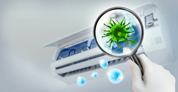 istock 3D simulation of viruses inside the air conditioner by showing through a magnifying glass and virus inside blue oxygen bubble. 1334914096