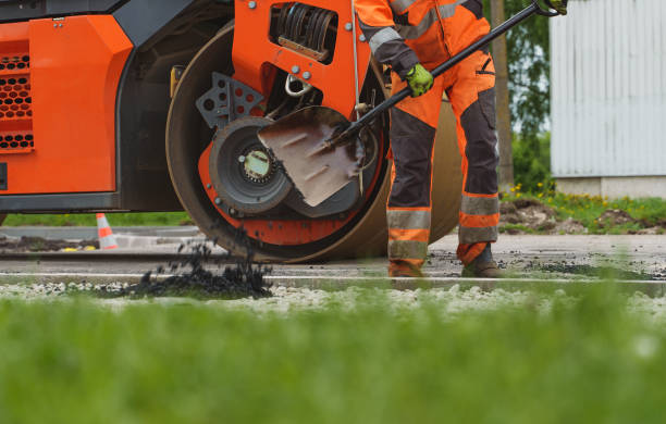 istock Road reconstruction. Heavy vibration road roller stacking hot asphalt. 1334914444