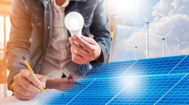 istock Electrical engineering is designing sustainable energy use in buildings with the power of wind turbines and solar power. 1334914570