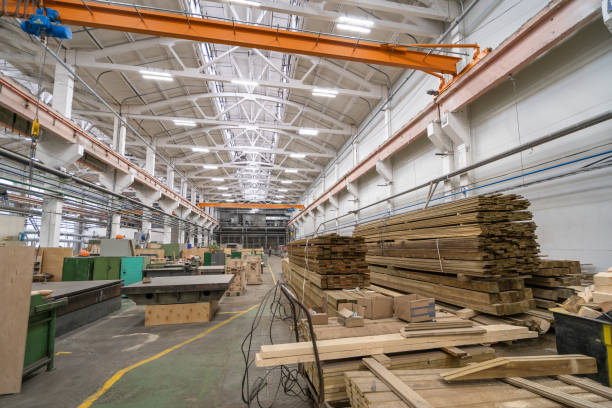 istock Inside huge factory workshop interior with stacks of wood for making molds. Woodwork manufacture production industry 1334918751