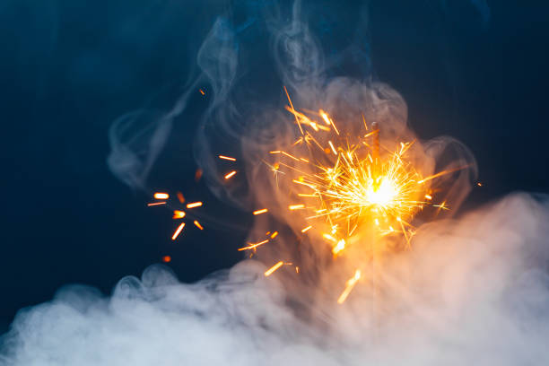 istock fire sparkler in dense smoke, abstract Christmas firework background 1334926115