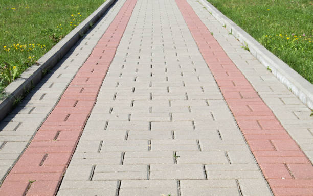 istock Brick path or sidewalk with perspective going into the distance with soft sunlight reflecting of the bricks. 1334927591