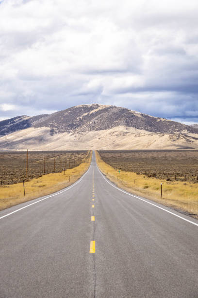 istock A long, straight road heading into the distant mountains 1334929228