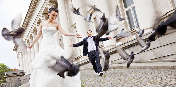 istock happy bride and groom doves 133493281
