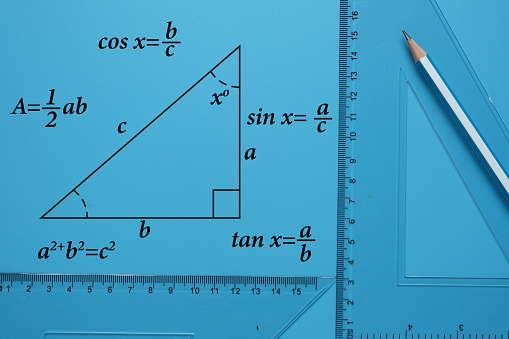 Wood triangle shaped ruler on white background. 3D rendering. Horizontal composition.