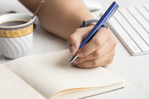 istock writing a letter envelope on a blank diary, work desk, in the background a keyboard, workplace and lifestyle 1334941208