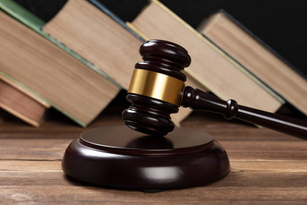 istock gavel on a table with some books on background 1334942742