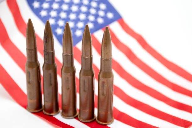 istock Cartridges from automatic weapons on the USA flag 1334944932