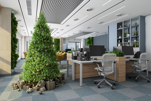 Christmas Tree With Ornaments And Gift Boxes In Eco Friendly Open Plan Office