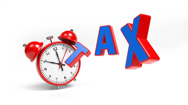 istock Red-framed tax text and red-colored clock. 1334954661