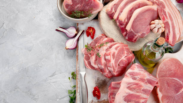 Meat Assortment of raw pork meat on light grey background. Organic gourmet food concept. Top view, flat lay, copy space knuckle joint stock pictures, royalty-free photos & images
