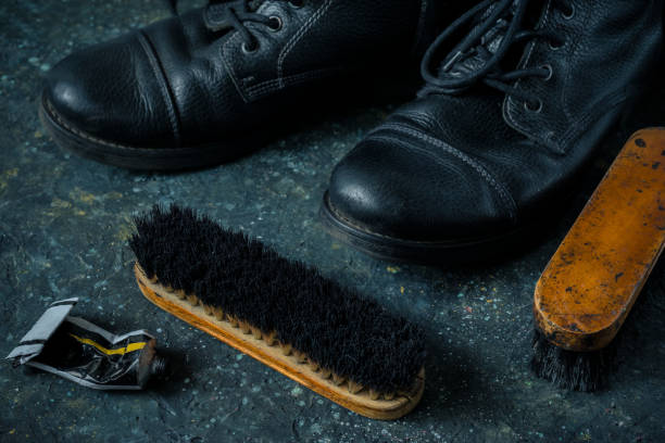 istock Old vintage leather boots with shoe brush 1334963364