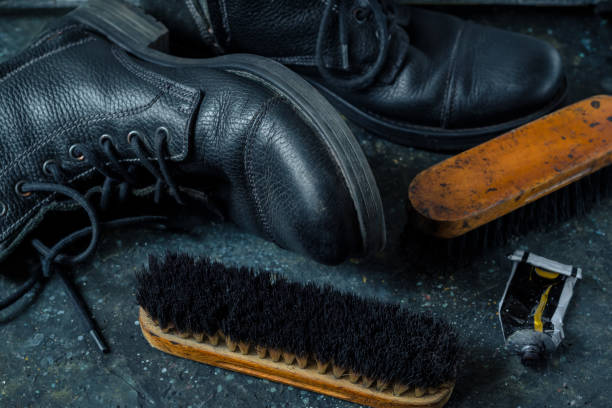istock Old vintage leather boots with shoe brush 1334963368