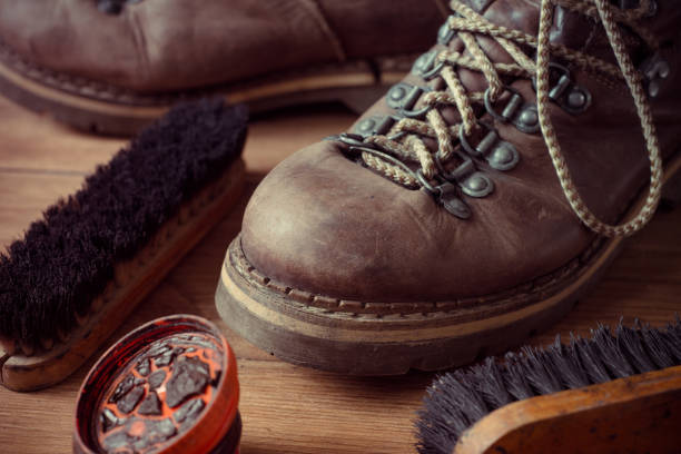 istock Old vintage leather boots with shoe brush 1334963385