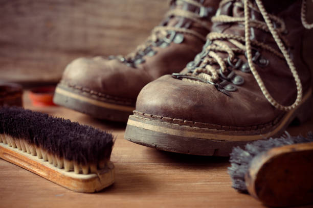 istock Old vintage leather boots with shoe brush 1334963387