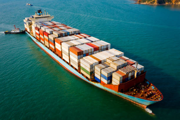 istock Aerial view large container ship and tug boat for logistics, import export, or transportation business and industrial Service international by ocean fright 1334964139