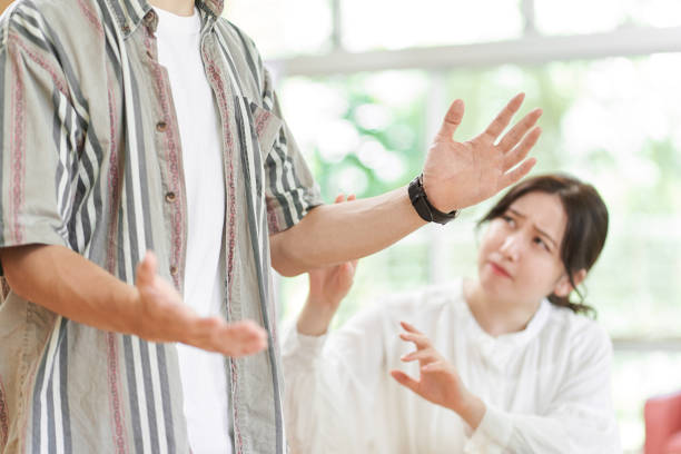 hands of a man arguing - arguing senior adult conflict couple imagens e fotografias de stock