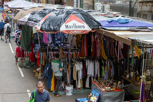 Hong Kong - August 18, 2021 : People at the Chun Yeung Street Market in North Point, Hong Kong. The stall selling bargain-priced clothing.