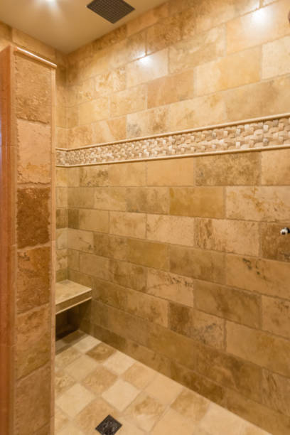 istock Beige tiles in remodeled shower 1334968923