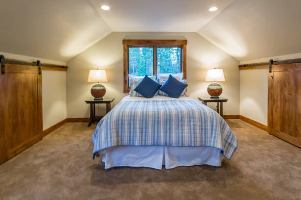 istock Upstairs bedroom with unique ceiling and walls 1334969210