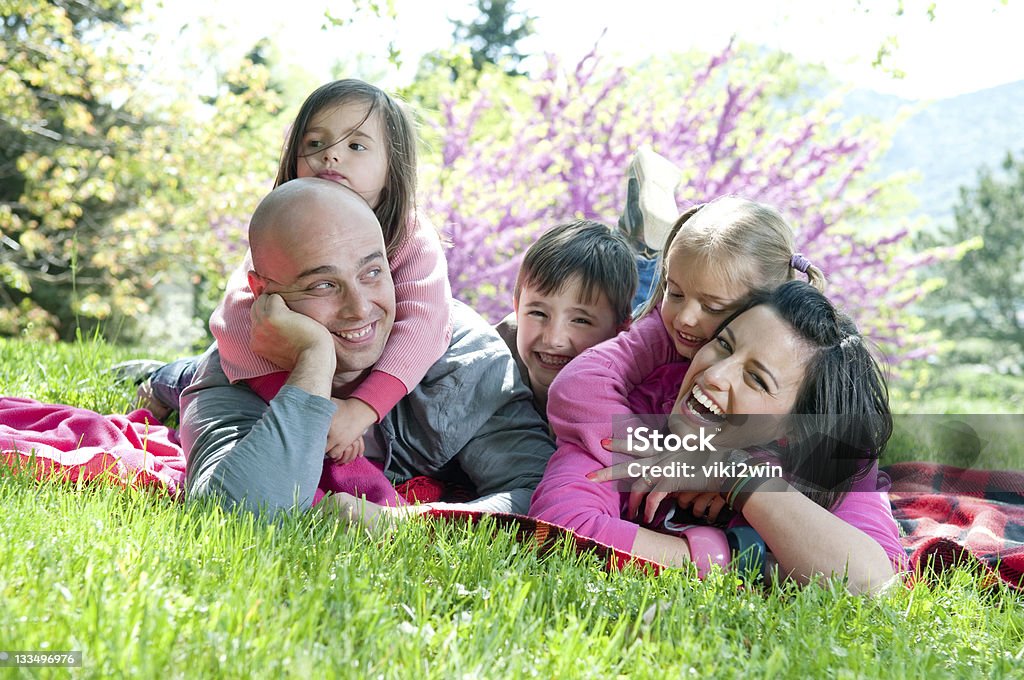 Happy family Happy family lying on a blanket Adult Stock Photo