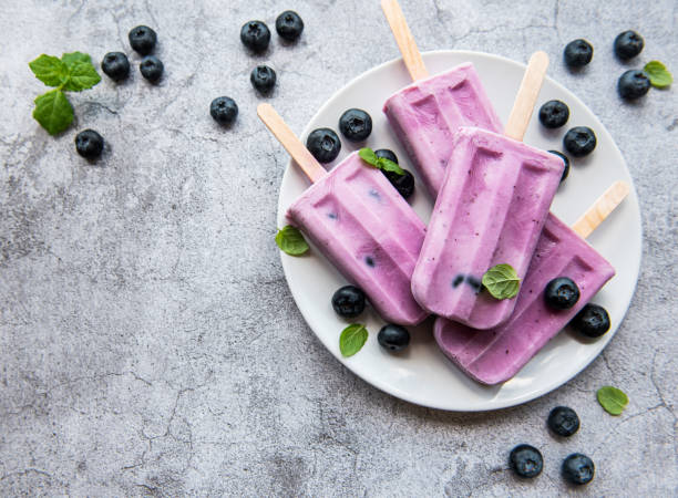 istock Ice cream popsicles from fresh organic blueberries. 1334972212