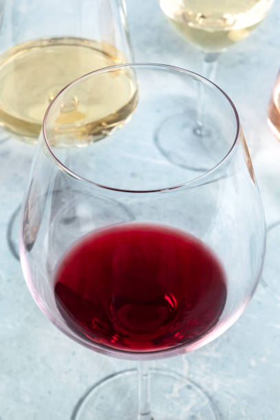 istock Red and white wine in different glasses at a wine tasting. 1334973193