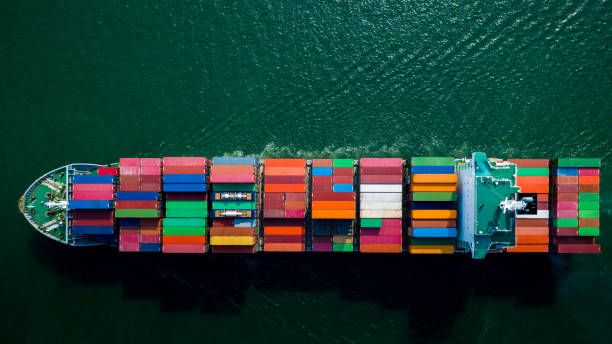 istock Container ship sailing the ocean, Business cargo logistics service and transportation of International container ship in the ocean freight transportation, Aerial view Container loading cargo freight 1334975199