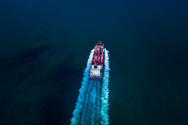 istock container cargo ship, business freight shipping international by container cargo ship in the sailing open sea at night process aerial view from drone 1334975203