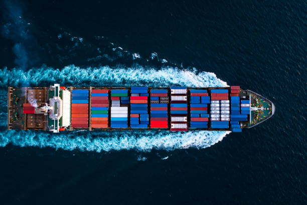 istock Aerial top view full speed container ship in the deep blue sea for cargo logistics import and export transportation international asia pacific 1334975219