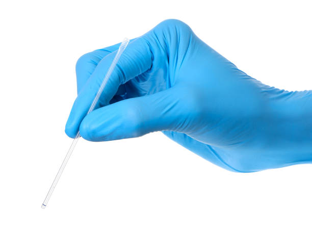 istock Scientist wears blue rubber gloves hands holding transparent plastic laboratory pipette or dropper isolate on white background with clipping path 1334976621