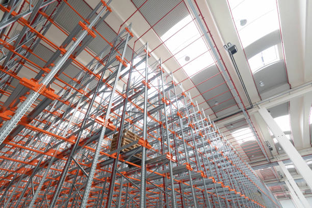 istock Industrial construction and roof in an empty warehouse 1334980092