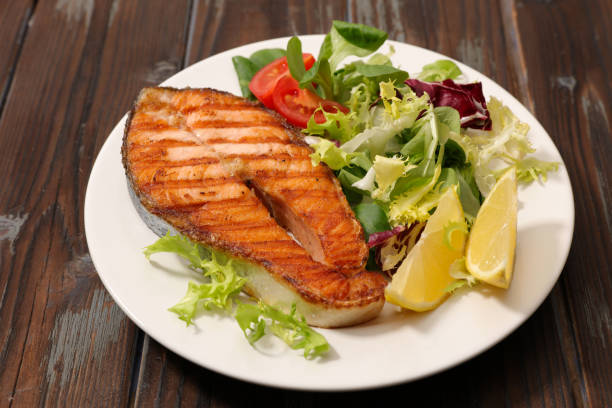 istock grilled salmon steak and lettuce 1334981522