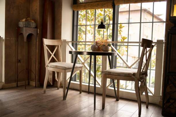 Tables and chairs standing empty in a restaurant