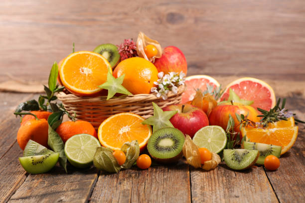 istock assorted of fresh fruit with orange, kiwi, apple and pomegranate 1334981784
